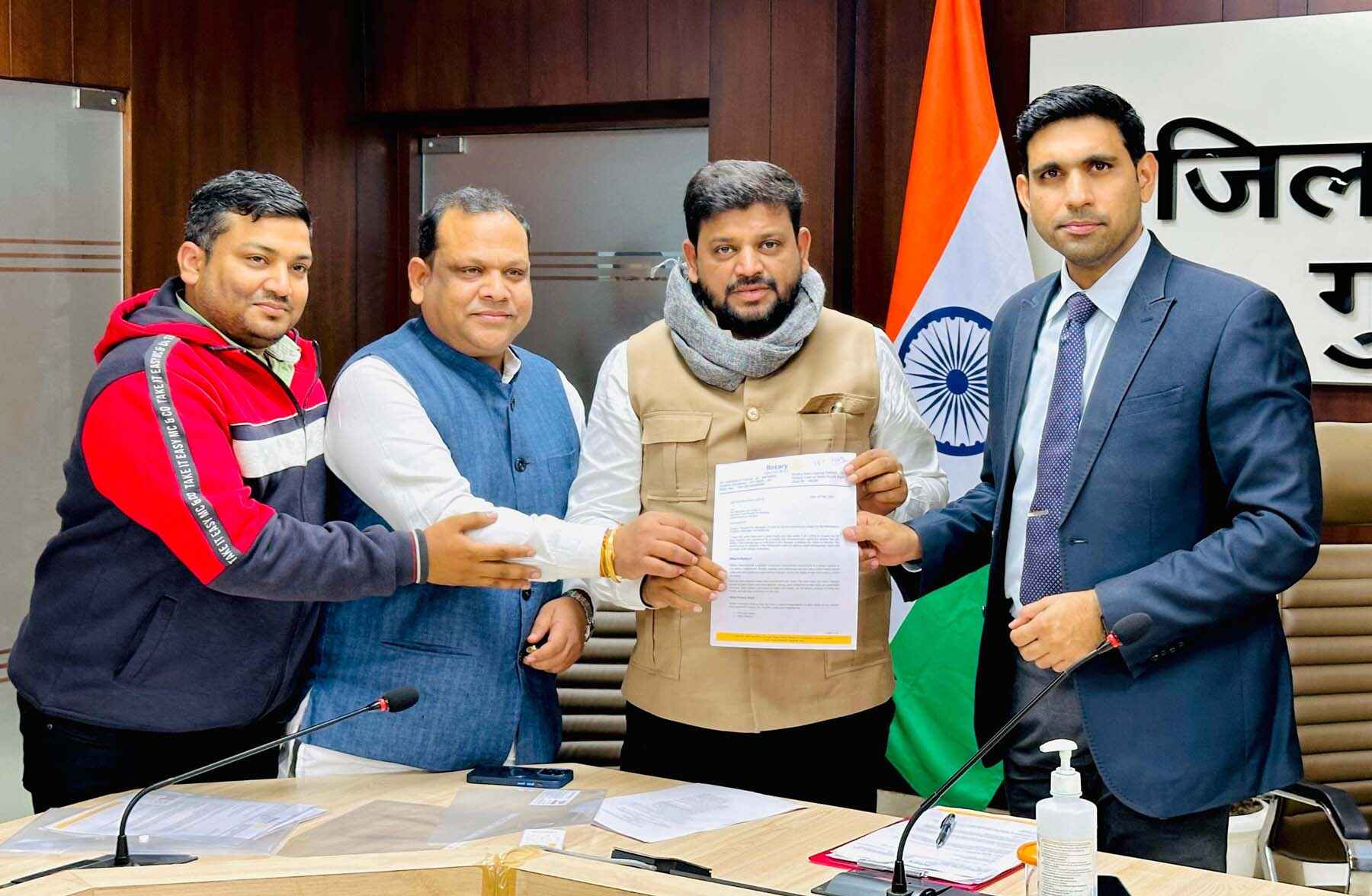 handing over a letter to Deputy Commissioner Nishant Kumar Yadav for work related to waste management and greenery of Gurugram